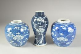 A PAIR OF 19TH CENTURY CHINESE BLUE AND WHITE PRUNUS JARS, together with similar vase, (3).
