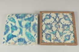 TWO EARLY 17TH CENTURY OTTOMAN IZNIK BLUE AND WHITE GLAZED POTTERY TILES, each approx. 25cm