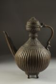 A FINE INDIAN BRONZE EWER, with ribbed body and engraved neck, 30cm high.