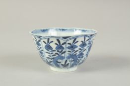 A CHINESE BLUE AND WHITE PORCELAIN CUP, painted with flora, 8.5cm diameter.