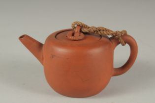 A SMALL CHINESE YIXING TEAPOT, 11.5cm spout to handle.