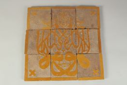 A PANEL OF NINE 18TH-19TH CENTURY NORTH AFRICAN MORROCCAN TILES, overall 30cm x 30cm.