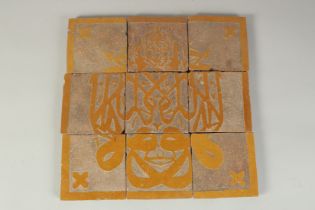 A PANEL OF NINE 18TH-19TH CENTURY NORTH AFRICAN MORROCCAN TILES, overall 30cm x 30cm.