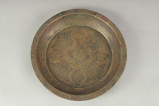 A 14TH -15TH CENTURY MAMLUK BRONZE DISH, with calligraphic decoration, 23.5cm diameter.