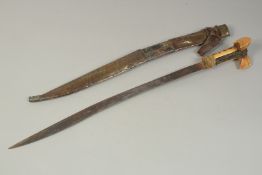 A 19TH CENTURY TURKISH YATAGHAN, with bone hilt inlaid with coral and ruby, the blade with