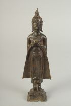 A BRONZE STANDING BUDDHA, 22cm high.