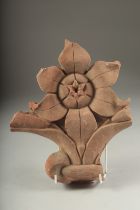 A FINE 17TH CENTURY MUGHAL INDIAN CARVED RED STONE FLOWER, 26cm high.