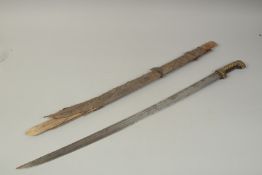 A 19TH CENTURY PERSIAN SWORD, the blade with calligraphy and maker's name, in original scabbard,
