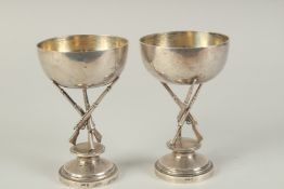 A PAIR OF CHINESE SILVER HUNTING RIFLE FOOTED CUPS, hallmarks to the foot rim, 14.5cm high.