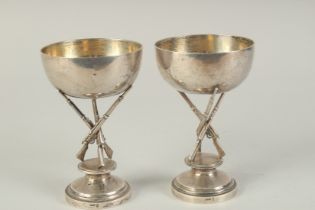 A PAIR OF CHINESE SILVER HUNTING RIFLE FOOTED CUPS, hallmarks to the foot rim, 14.5cm high.
