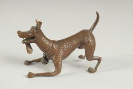 A JAPANESE BRONZE OKIMONO OF A DOG, with hanging bell on the collar, mark to underside, 6.5cm long.