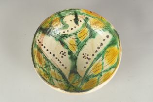 A 9TH-10TH CENTURY PERSIAN SPLASH WARE GLAZED POTTERY BOWL, 18cm diameter.