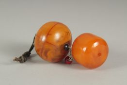 TWO LARGE AMBER BEADS, 123g, (2).