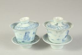 A SMALL PAIR OF CHINESE BLUE AND WHITE PORCELAIN LIDDED CUPS AND STANDS, (one cup damaged), (x4