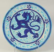 A VERY LARGE AND UNUSUAL EARLY 19TH CENTURY INDIAN MULTAN CHARGER, with European lion painted to the