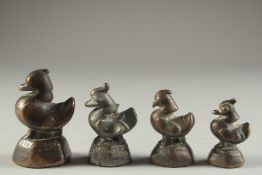 A COLLECTION OF FOUR 18TH-19TH CENTURY BURMESE BRONZE BIRD SHAPED WEIGHTS.