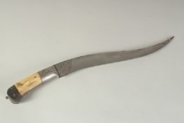 AN INDIAN BONE HILTED DAGGER, with engraved blade, 43cm long.