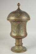 A FINE LARGE 19TH CENTURY PERSIAN QAJAR ENGRAVED AND OPENWORKED BRASS LIDDED VASE, 53cm high.