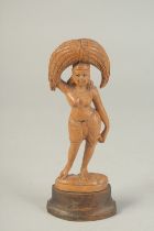 AN INDIAN CARVED WOOD FIGURE, 19cm high.