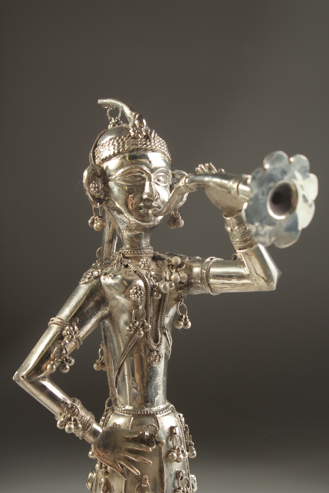 A FINE PAIR OF 19TH CENTURY INDIAN SILVER FIGURES OF MUSICIANS, 30cm high. - Image 5 of 11