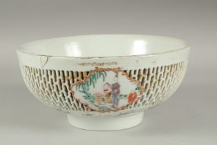 A LARGE CHINESE EXPORT FAMILLE ROSE PIERCED PORCELAIN BOWL, the openworked exterior with three