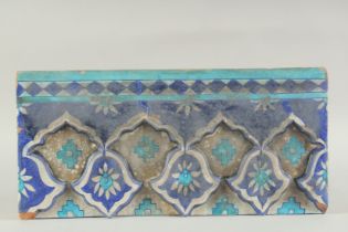 A LARGE 17TH -18TH CENTURY NORTH INDIAN MULTAN TILE, 45cm x 21.5cm.