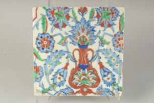 AN OTTOMAN TURKISH GLAZED POTTERY TILE, 24.5cm square.