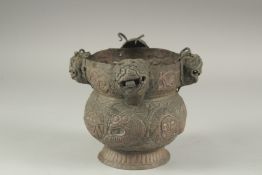 A CHINESE EMBOSSED AND CHASED COPPER POT, 15cm high.