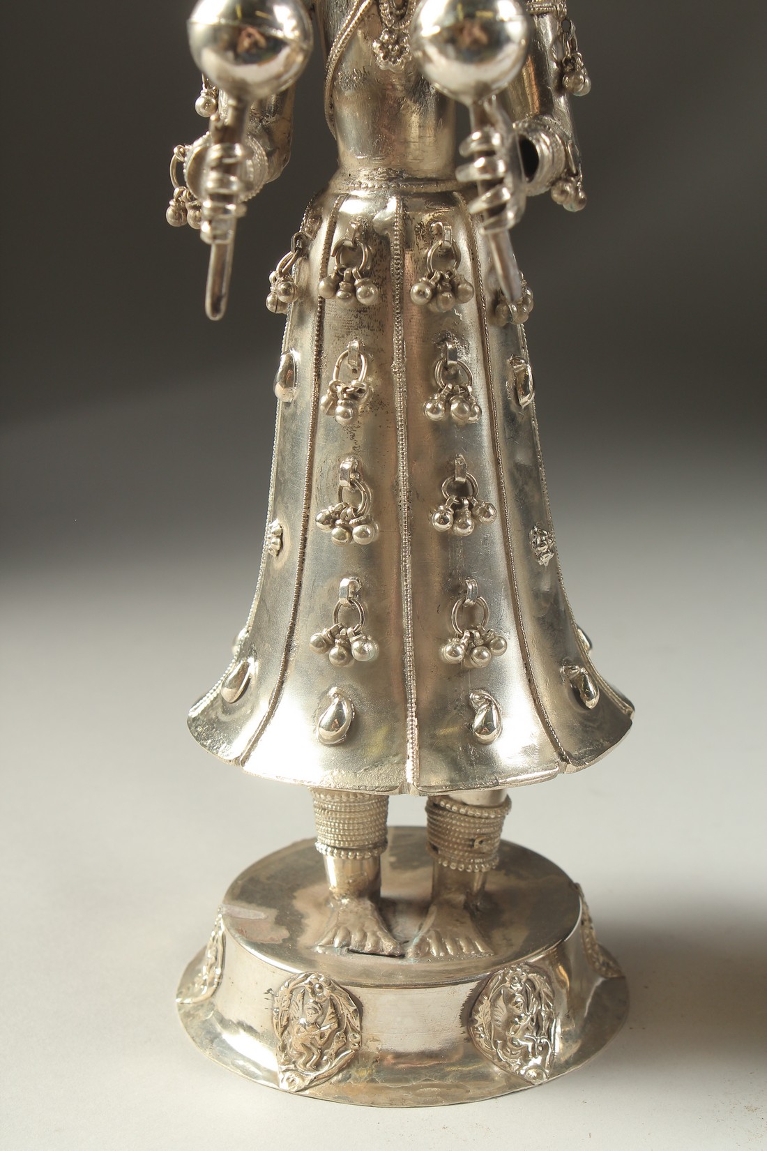 A FINE PAIR OF 19TH CENTURY INDIAN SILVER FIGURES OF MUSICIANS, 30cm high. - Image 6 of 11