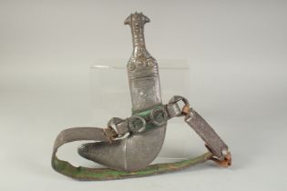 A FINE OMANI SILVER DAGGER AND BELT.