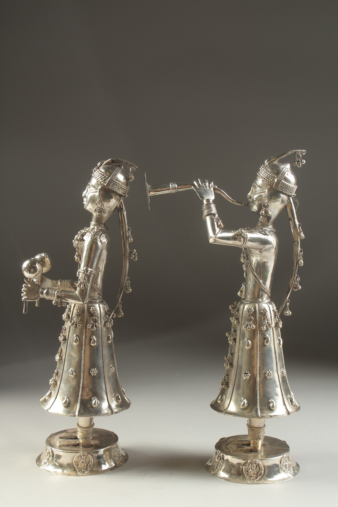 A FINE PAIR OF 19TH CENTURY INDIAN SILVER FIGURES OF MUSICIANS, 30cm high. - Image 10 of 11