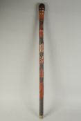 A CHINESE BAMBOO WALKING STICK, carved with fish, 90cm long.