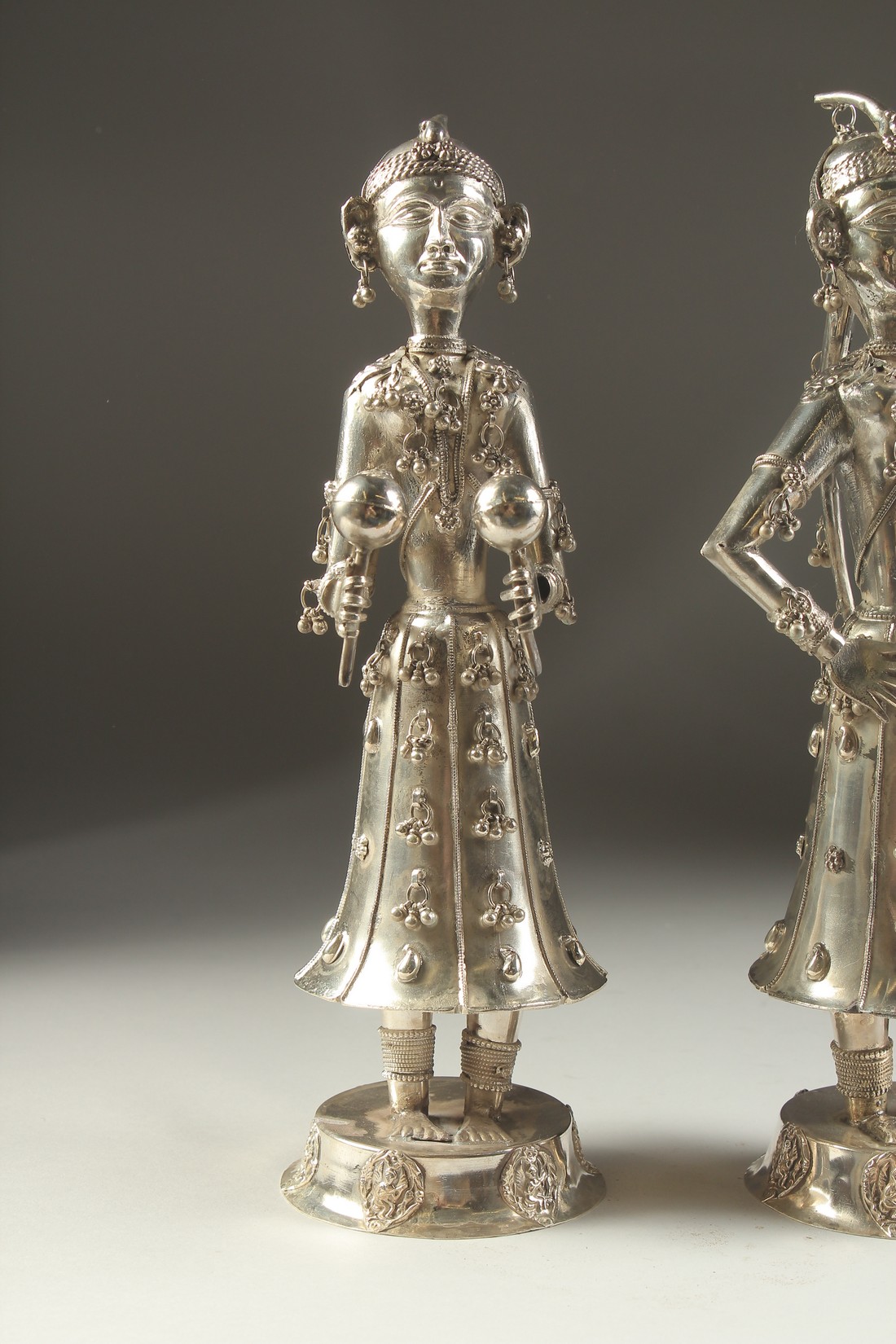 A FINE PAIR OF 19TH CENTURY INDIAN SILVER FIGURES OF MUSICIANS, 30cm high. - Image 2 of 11