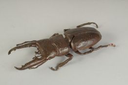A JAPANESE BRONZE OKIMONO OF A STAG BEETLE, with hinged back opening to reveal inner compartment,