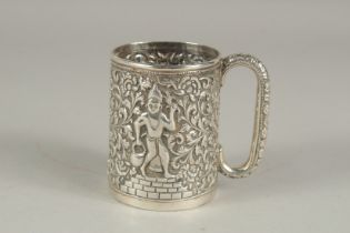 AN INDIAN SILVER EMBOSSED AND CHASED CUP, 8cm high.