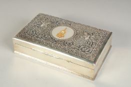 A ROYAL THAI SILVER AND NIELLO BOX, inlaid with a single piece of high carat gold, 15.5cm x 9.5cm.