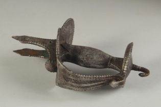 A 17TH CENTURY INDIAN MUGHAL SWORD HANDLE, 20cm long.