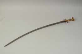 A FINE 19TH CENTURY INDIAN TULWAR, the blade with inscription, 89.5cm long.