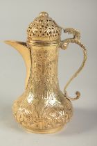 AN OTTOMAN TURKISH GILDED COFFEE POT, 16cm high.