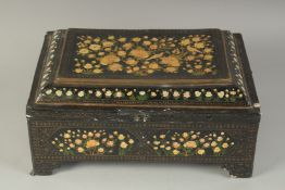 A TURKISH OTTOMAN LACQUERED WRITING BOX, with hinged lid, painted with birds and flora, 38.5cm x