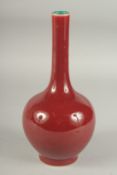 A CHINESE OXBLOOD GLAZE PORCELAIN BOTTLE VASE, the base with character mark, 26cm high.
