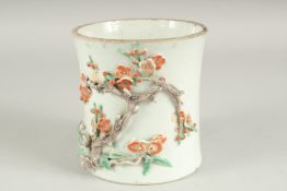 A CHINESE PORCELAIN RELIEF DECORATED SLEEVE SECTION - POSSIBLY FROM A VASE, the moulded relief