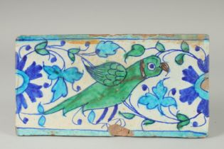 A FINE 18-19TH CENTURY MUGHAL NORTH INDIAN MULTAN TILE WITH PARROT DESIGN, 29cm x 15.5cm.