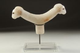A FINE 19TH-EARLY 20TH CENTURY MUGHAL INDIAN CARVED WHITE JADE CRUTCH HANDLE, formed with two ram'