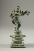 A FINE 16TH-17TH CENTURY SOUTH INDIAN BRONZE FIGURE OF BABY KRISHNA, stand on a lotus form base,