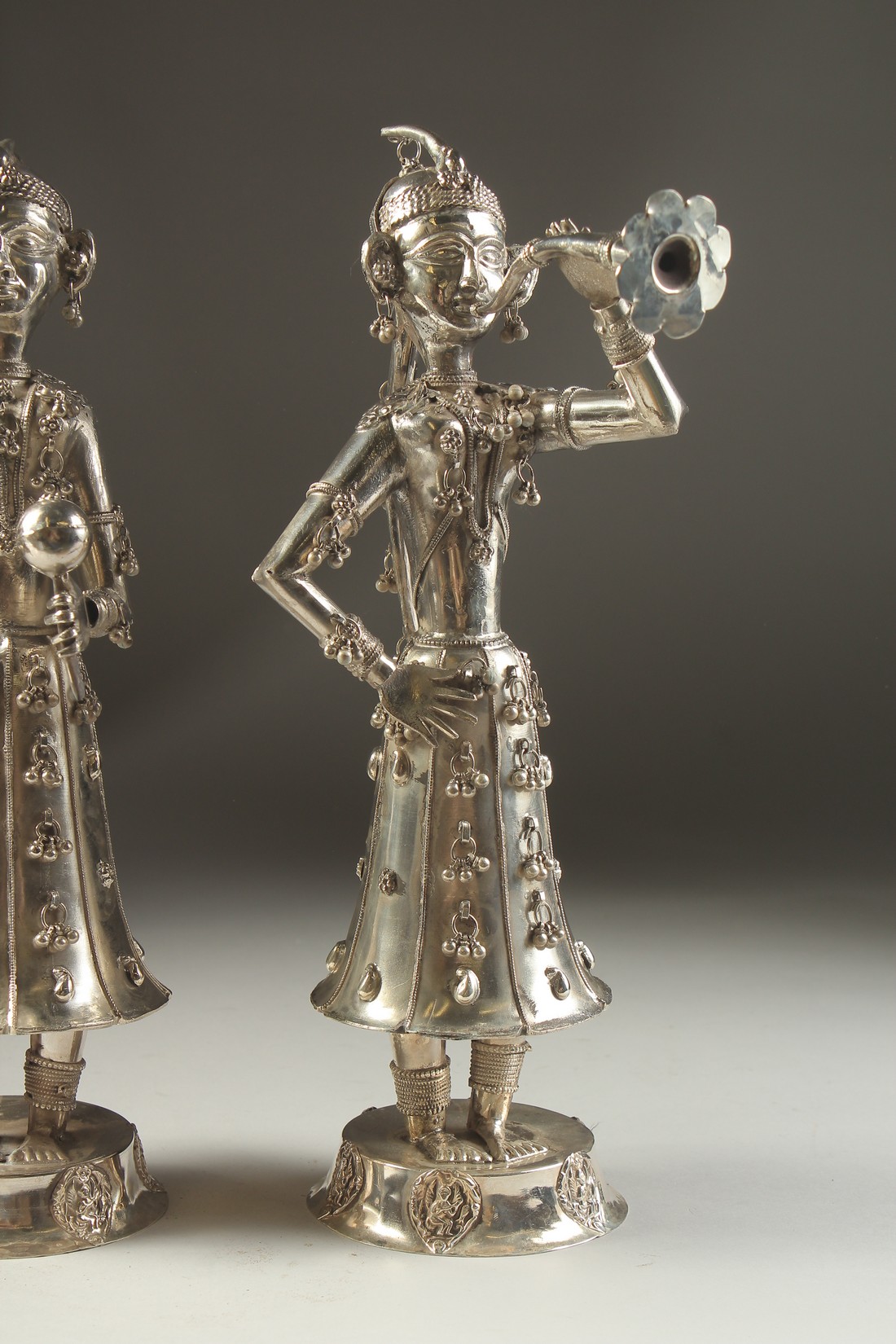 A FINE PAIR OF 19TH CENTURY INDIAN SILVER FIGURES OF MUSICIANS, 30cm high. - Image 3 of 11