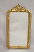 A GOOD LARGE GILTWOOD UPRIGHT MIRROR with acanthus and scrolls. 5ft 2ins high, 2ft 7ins wide.