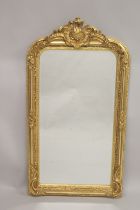 A GOOD LARGE GILTWOOD UPRIGHT MIRROR with acanthus and scrolls. 5ft 2ins high, 2ft 7ins wide.