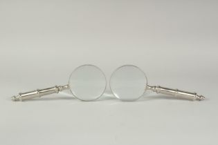 A PAIR OF CHROME HANDLE MAGNIFYING GLASSES.