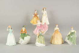 A COLLECTION OF EIGHT ROYAL DOULTON FIGURINES OF LADIES.